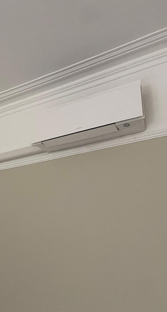 Close-up of a newly installed wall-mounted air conditioning unit