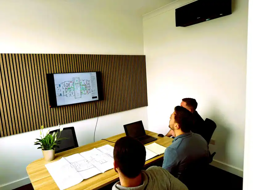 AKS design meeting reviewing installation drawings